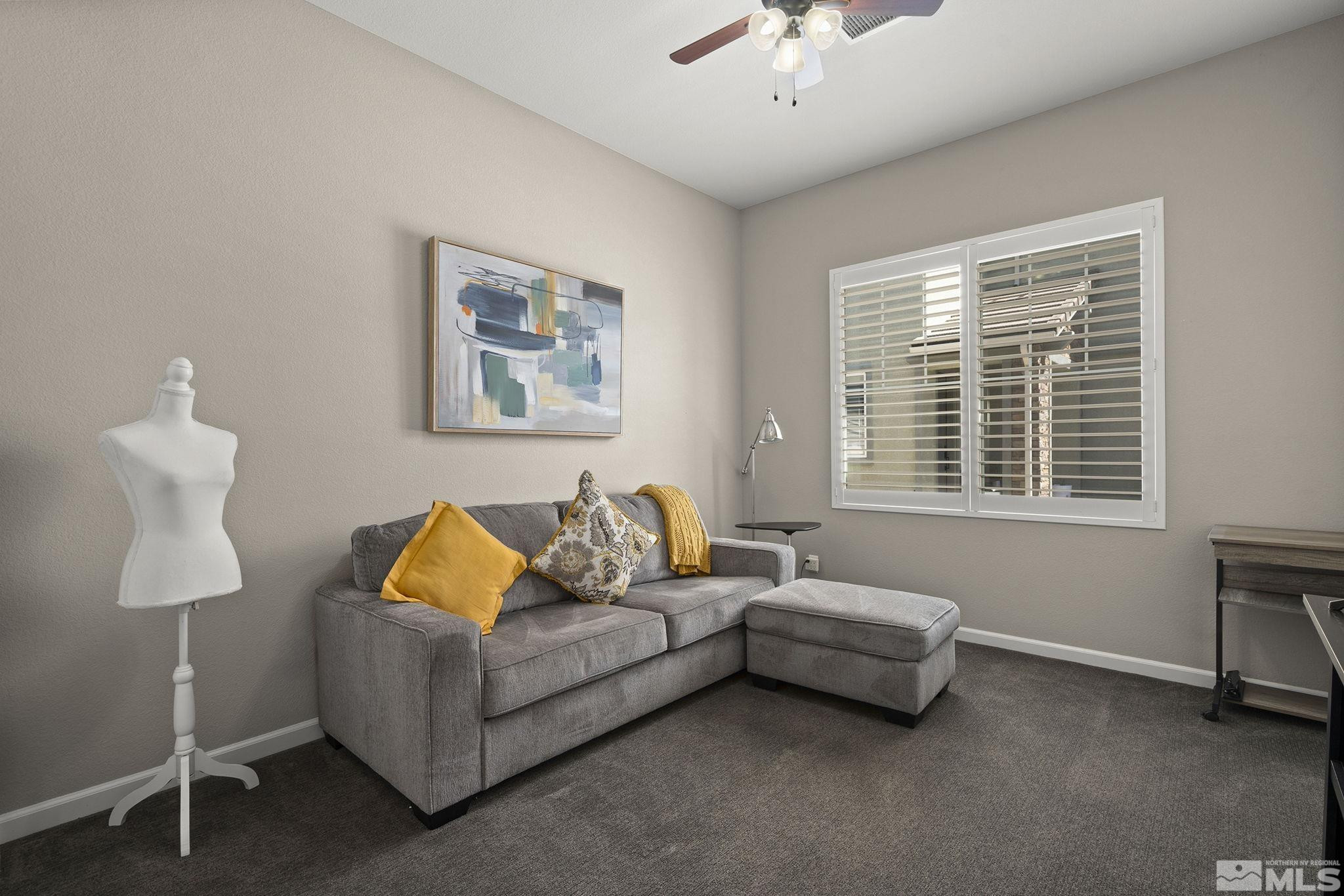 2975 Show Jumper Lane Reno, NV 89521 - Photo 19 of 32 a living room with furniture and a window