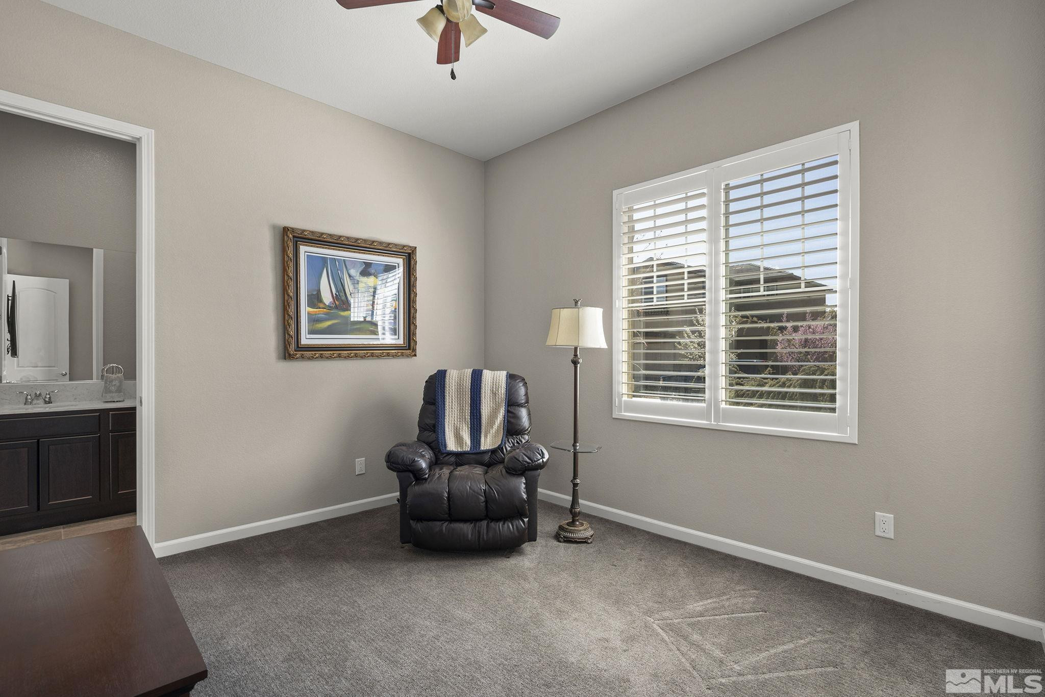 2975 Show Jumper Lane Reno, NV 89521 - Photo 21 of 32 a living room with furniture and a window