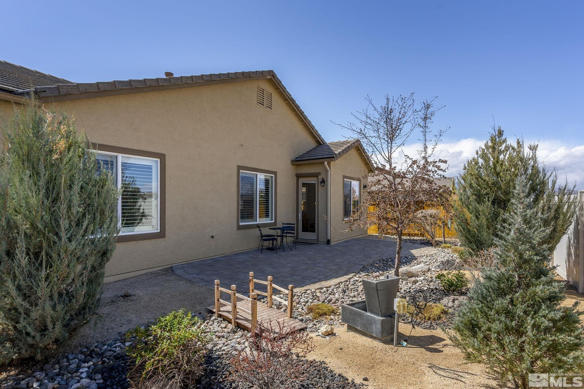2975 Show Jumper Lane Reno, NV 89521 - Photo 23 of 32 a view of house with backyard and outdoor seating