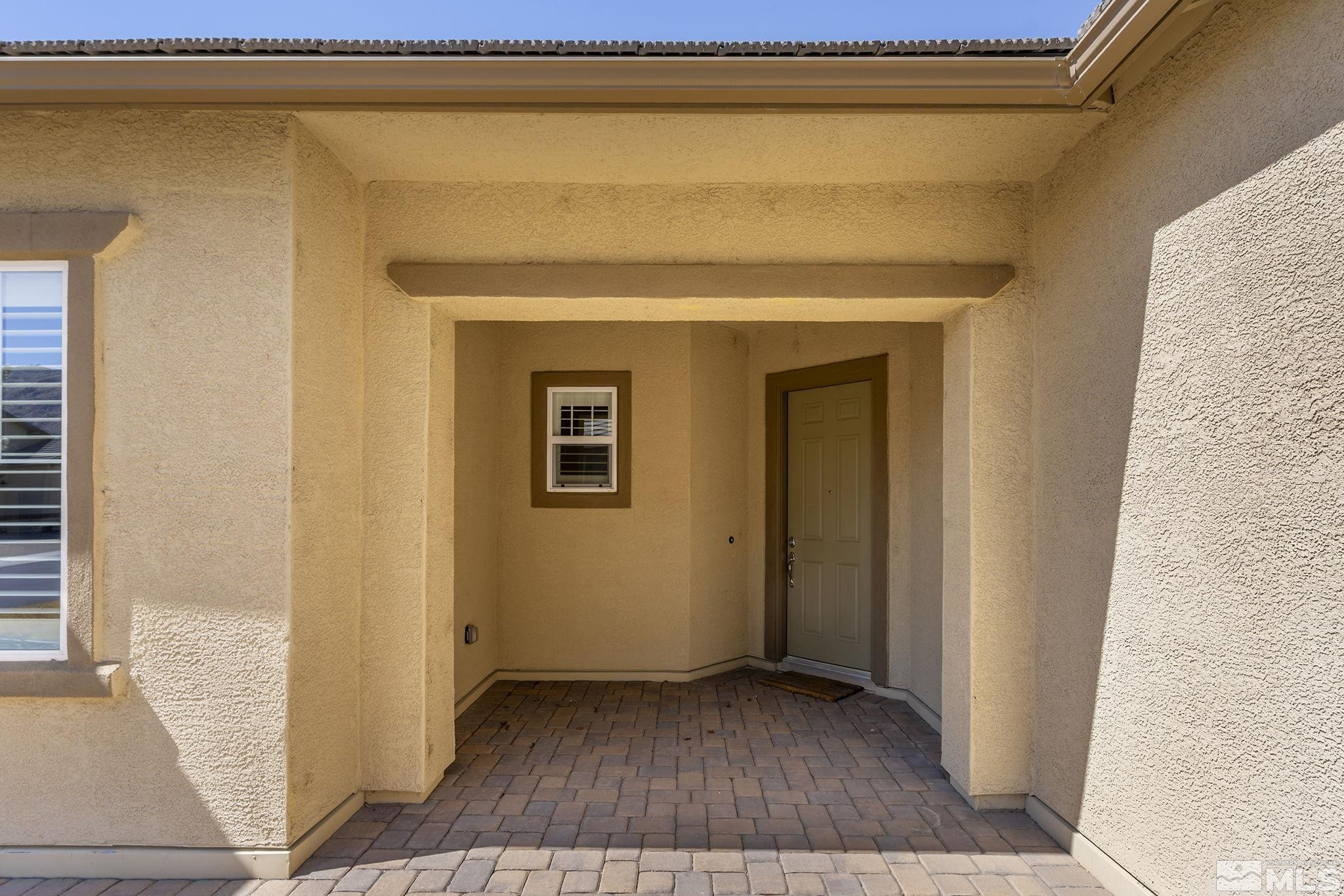 2975 Show Jumper Lane Reno, NV 89521 - Photo 3 of 32 a view of a small space with wooden floor and a window