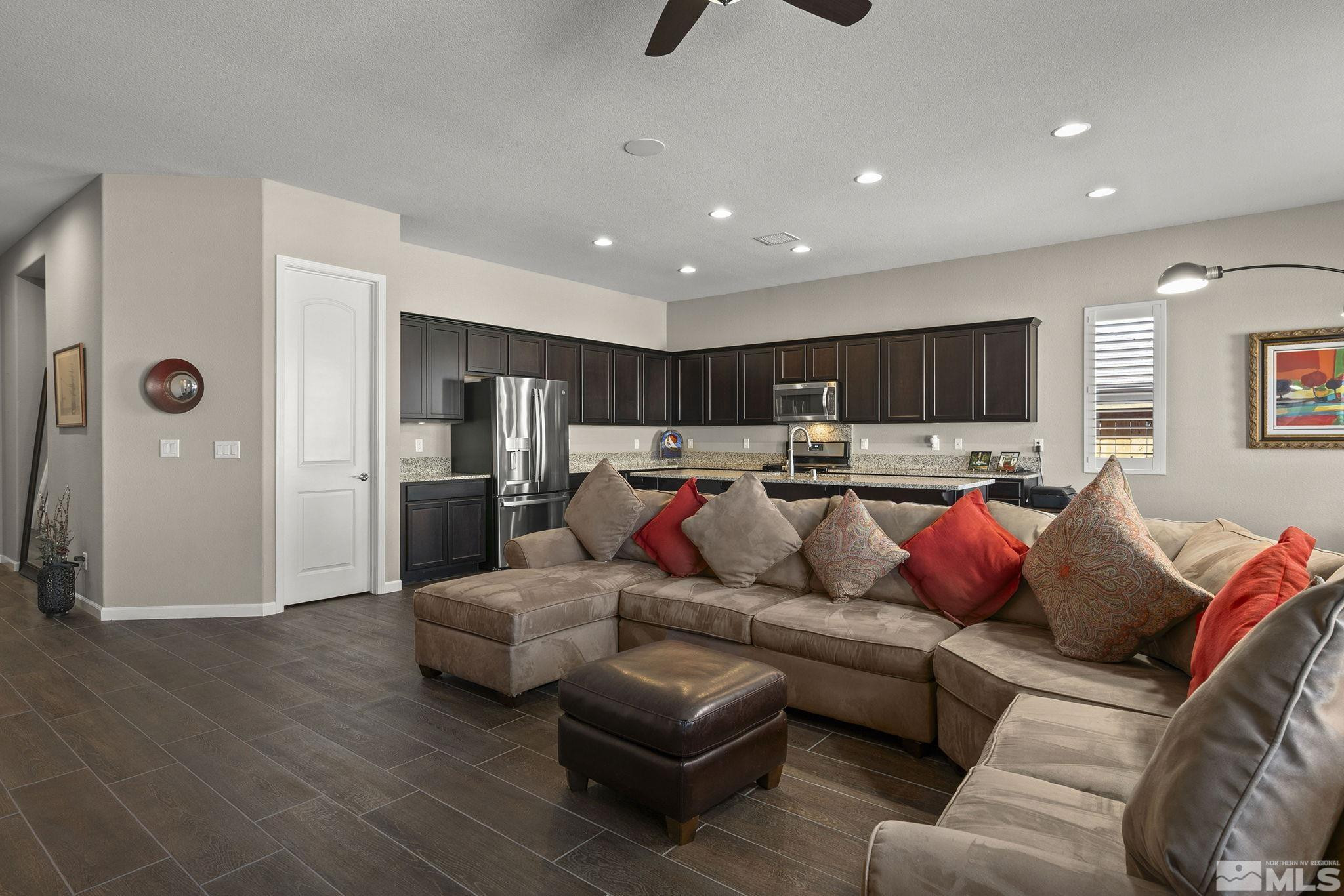 2975 Show Jumper Lane Reno, NV 89521 - Photo 7 of 32 a living room with furniture and kitchen view