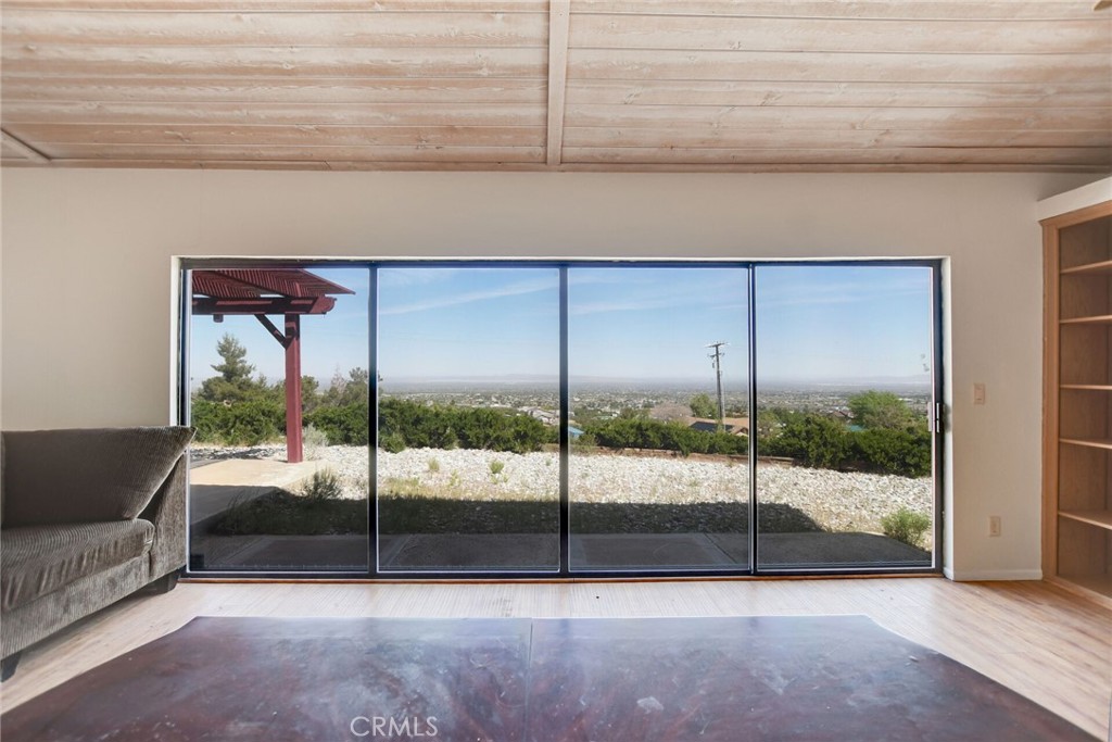 2929 Snow Line Drive Pinon Hills, CA 92372 - Photo 14 of 67 a view of an empty room with a balcony