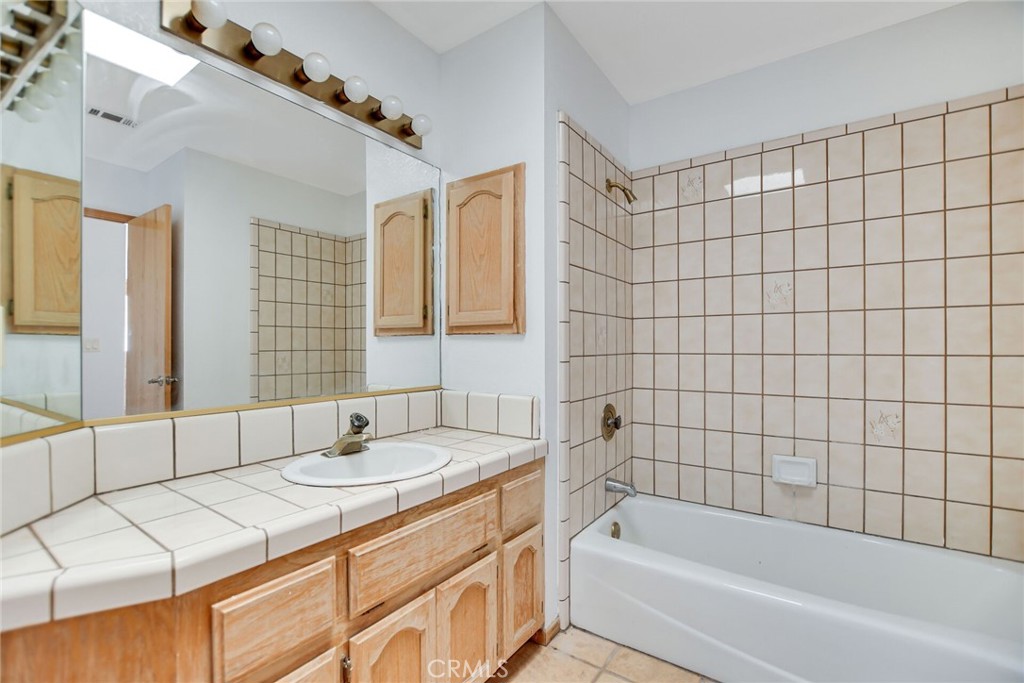 2929 Snow Line Drive Pinon Hills, CA 92372 - Photo 24 of 67 a bathroom with a sink and a bathtub