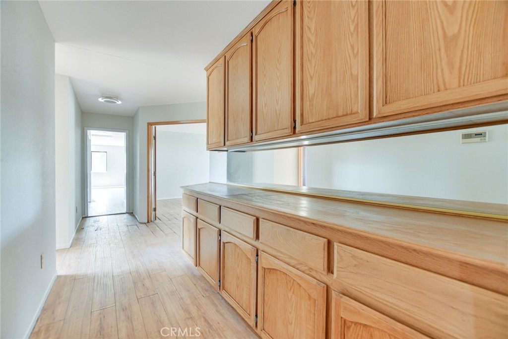 2929 Snow Line Drive Pinon Hills, CA 92372 - Photo 25 of 67 a kitchen with granite countertop stainless steel appliances sink and cabinets