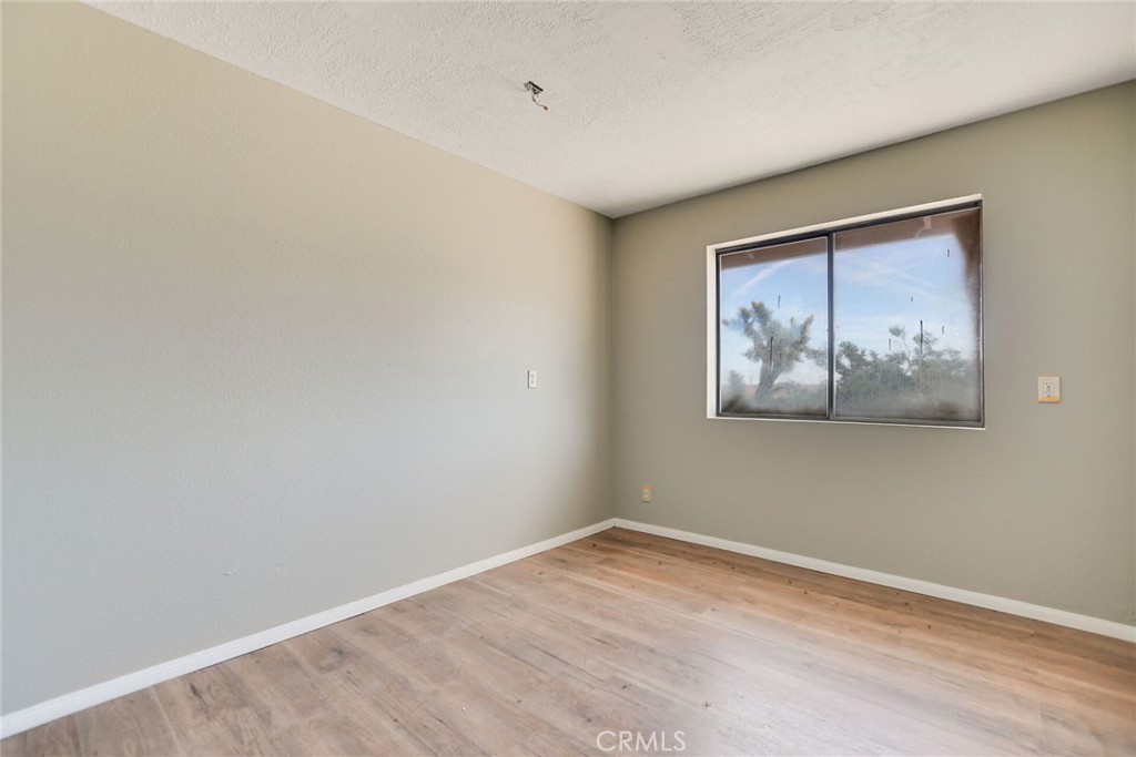 2929 Snow Line Drive Pinon Hills, CA 92372 - Photo 34 of 67 a view of empty room with wooden floor