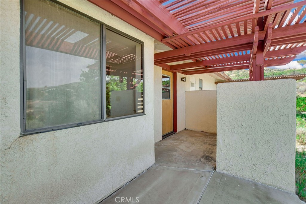 2929 Snow Line Drive Pinon Hills, CA 92372 - Photo 38 of 67 a view of a hallway with a large window