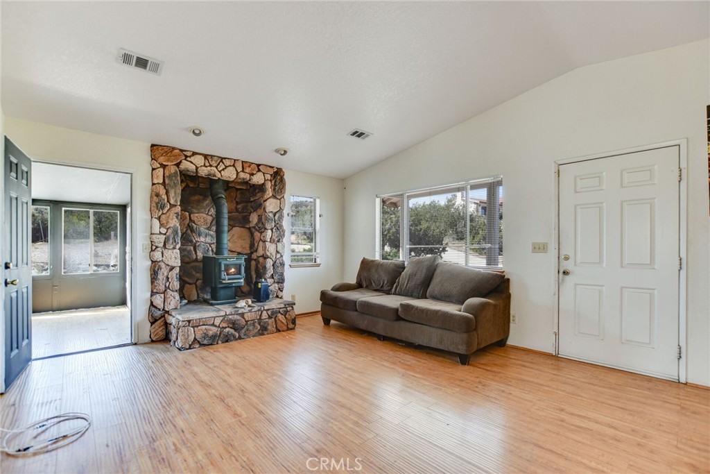 2929 Snow Line Drive Pinon Hills, CA 92372 - Photo 41 of 67 a living room with furniture and a large window