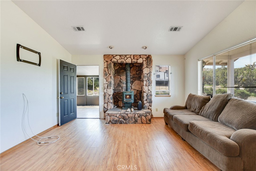 2929 Snow Line Drive Pinon Hills, CA 92372 - Photo 42 of 67 a living room with furniture and a large window