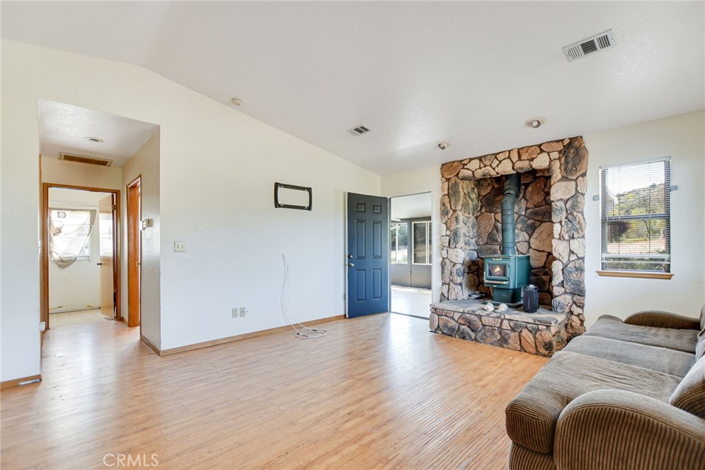 2929 Snow Line Drive Pinon Hills, CA 92372 - Photo 43 of 67 a living room with furniture and wooden floor
