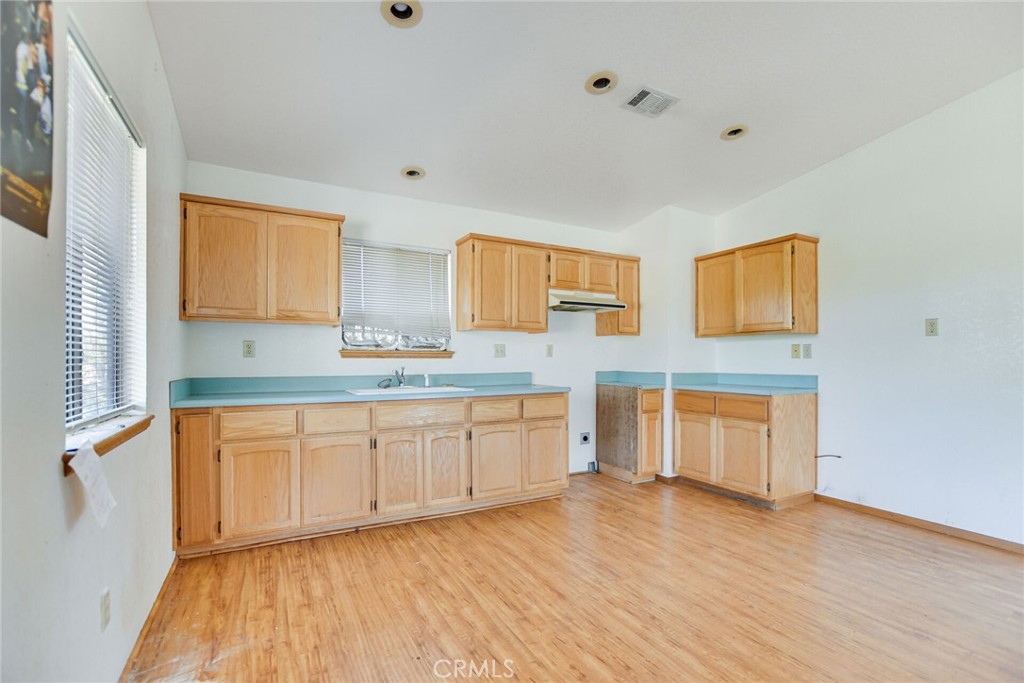 2929 Snow Line Drive Pinon Hills, CA 92372 - Photo 47 of 67 a spacious bathroom with a granite countertop sink and a vanity