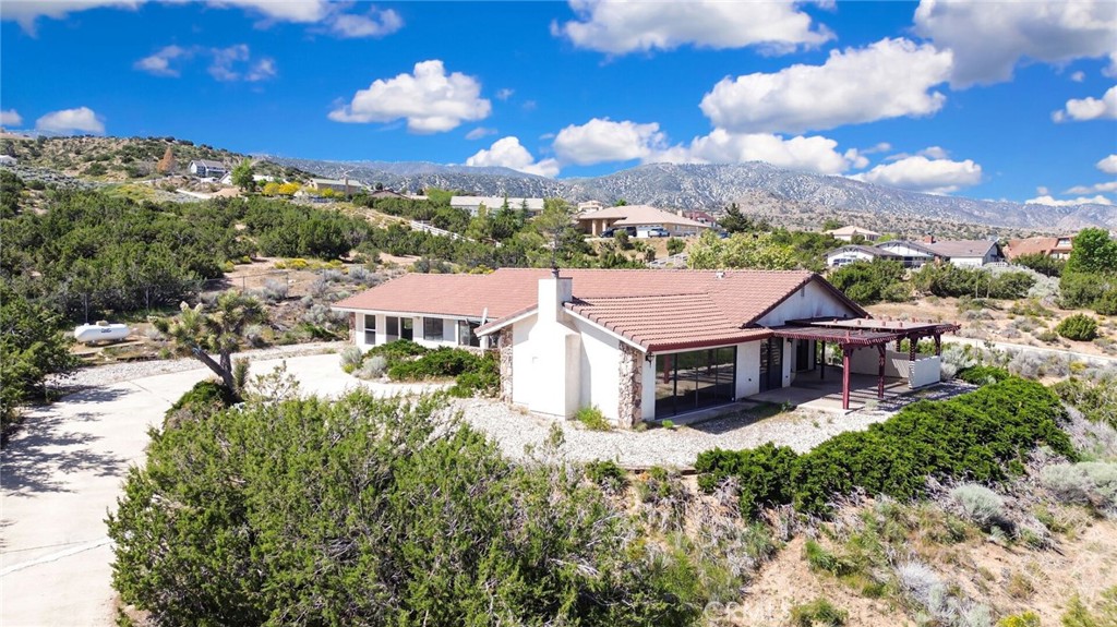 2929 Snow Line Drive Pinon Hills, CA 92372 - Photo 53 of 67 a aerial view of a house with a big yard