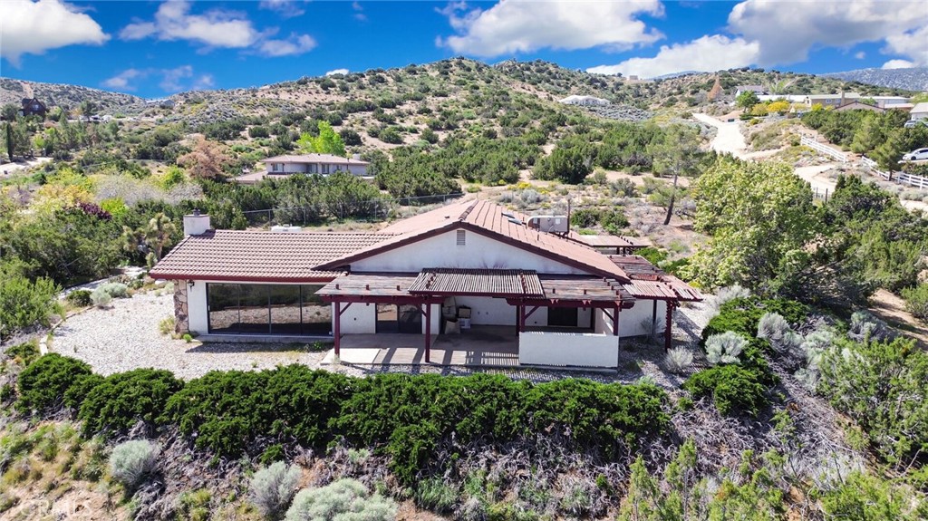 2929 Snow Line Drive Pinon Hills, CA 92372 - Photo 55 of 67 an aerial view of a house with a garden and balcony