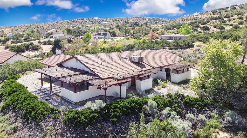 2929 Snow Line Drive Pinon Hills, CA 92372 - Photo 56 of 67 an aerial view of a house with a yard