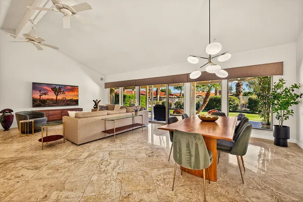 a living room with fireplace furniture and a flat screen tv