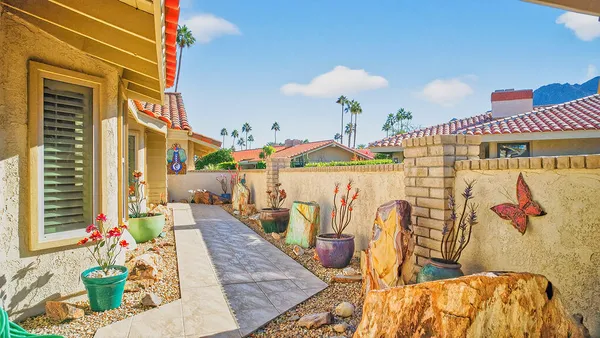 a view of living room kitchen and entryway