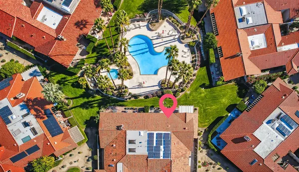 an aerial view of residential houses with outdoor space