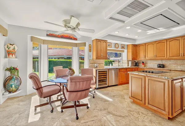 a kitchen with stainless steel appliances granite countertop a stove and a refrigerator
