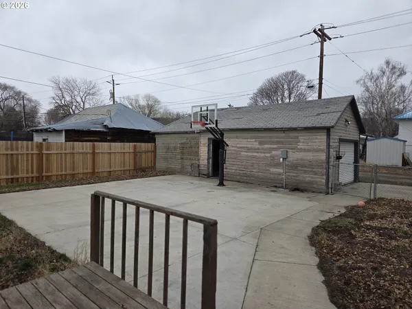 a view of a house with a wooden deck