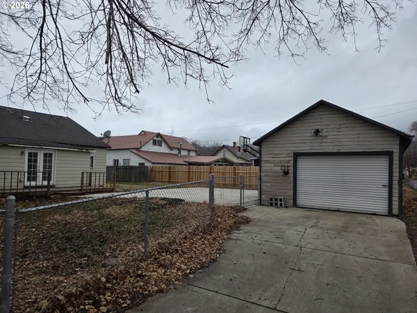 a house that has a tree in front of it