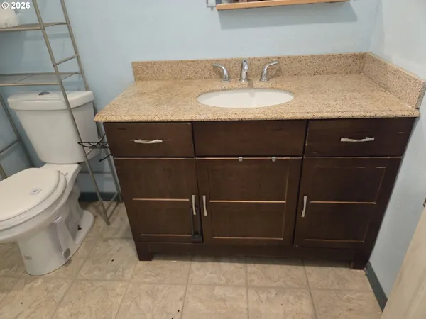 a bathroom with a sink and a toilet