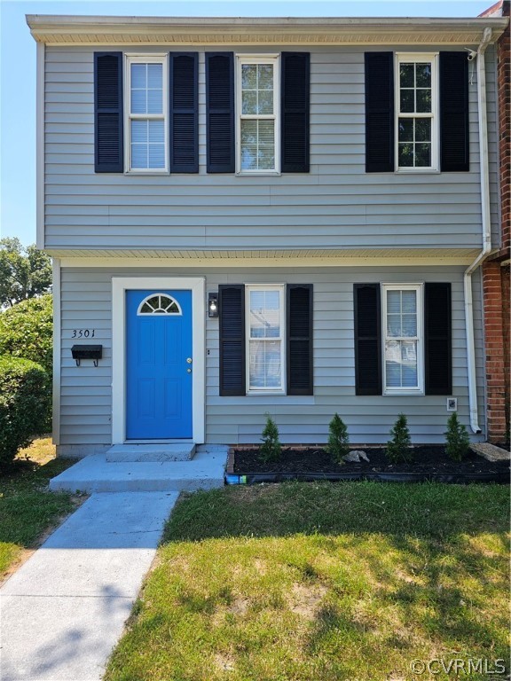 a large tree in front of a house