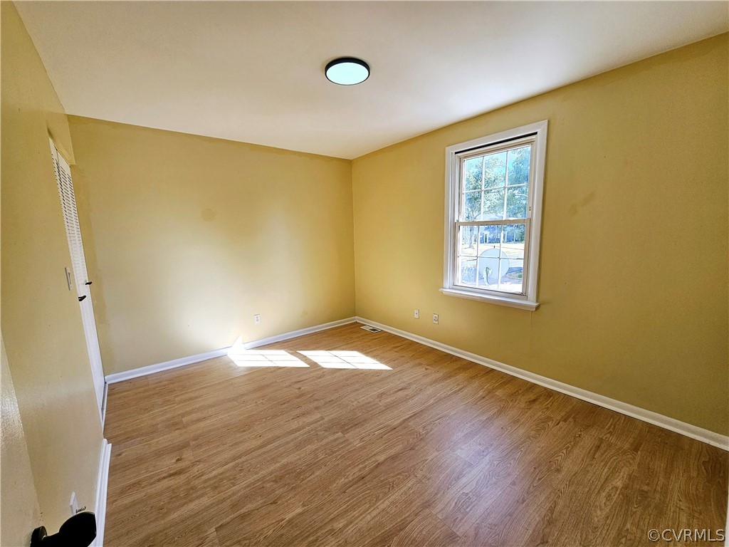 3501 Luckylee Crescent Richmond, VA 23234 - Photo 11 of 16 a view of empty room with wooden floor and fan