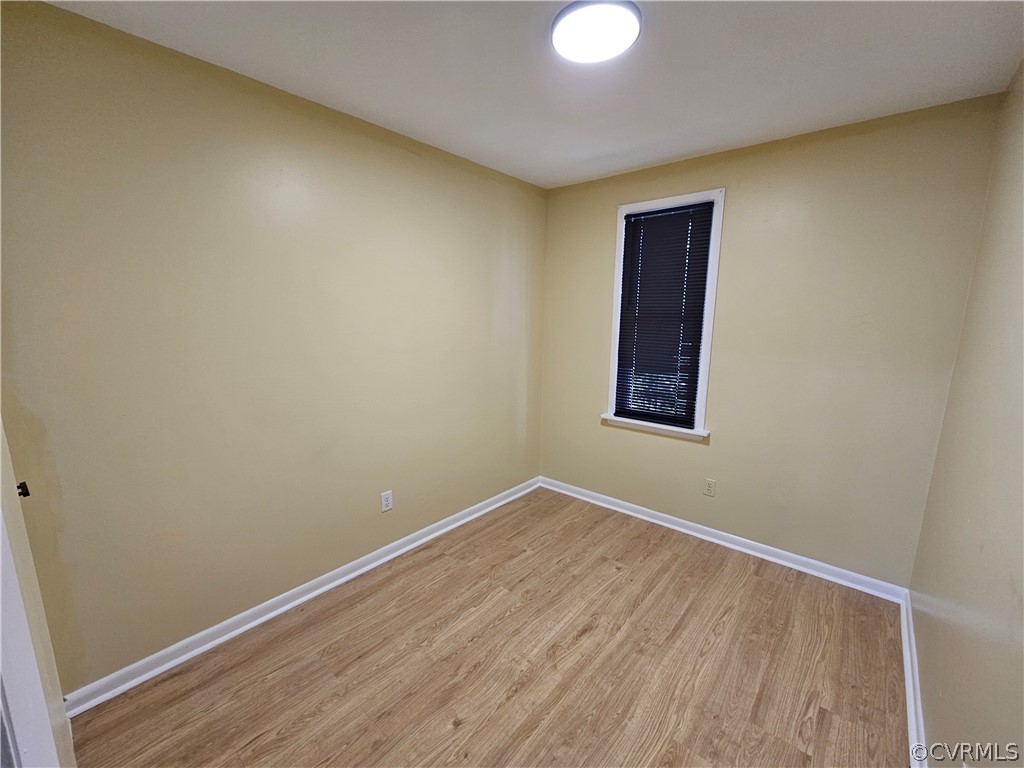 3501 Luckylee Crescent Richmond, VA 23234 - Photo 12 of 16 a view of an empty room with wooden floor and a window