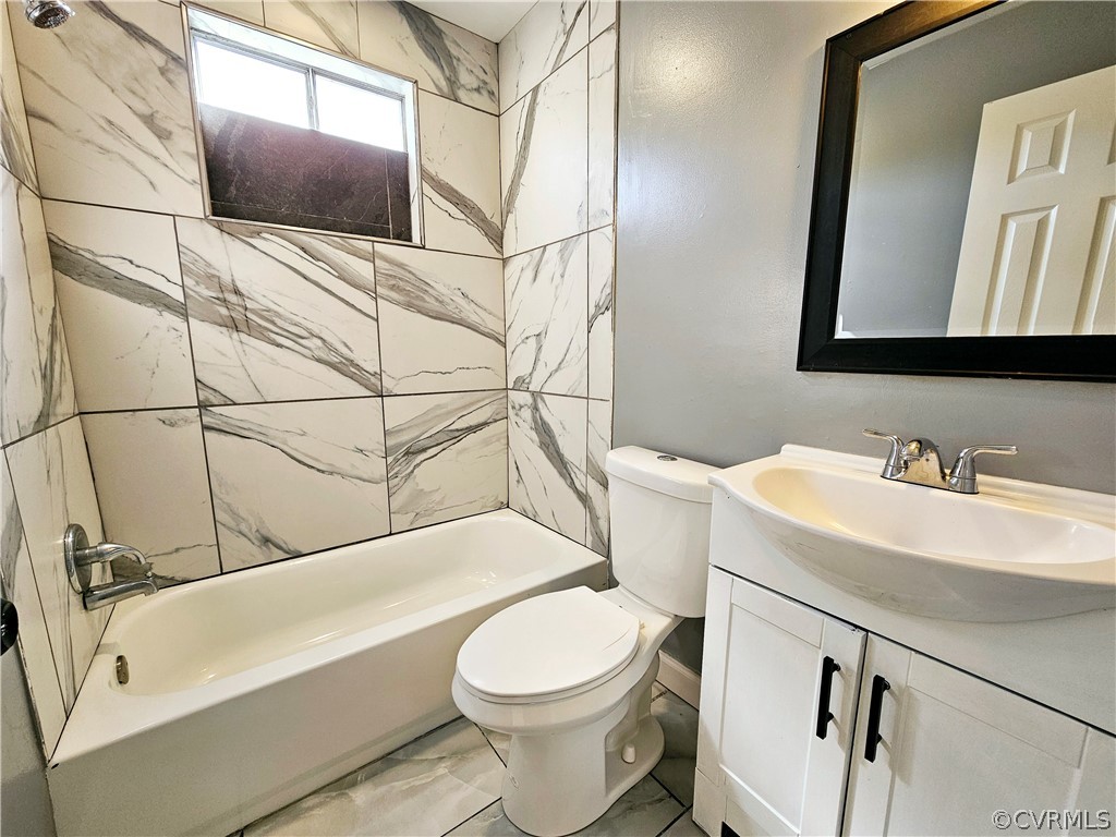 3501 Luckylee Crescent Richmond, VA 23234 - Photo 13 of 16 a bathroom with a sink a toilet and a mirror