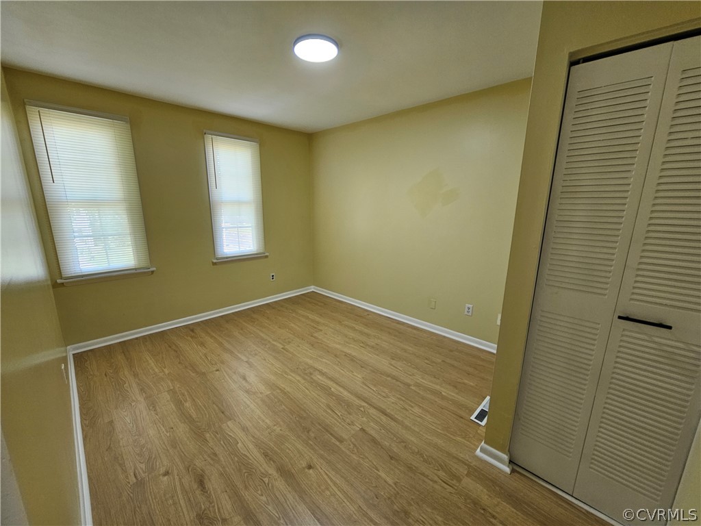 3501 Luckylee Crescent Richmond, VA 23234 - Photo 14 of 16 a view of empty room with wooden floor and fan