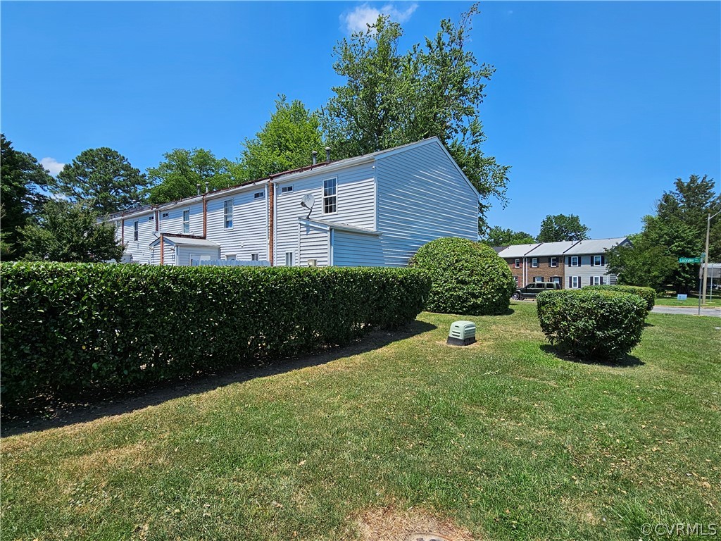 3501 Luckylee Crescent Richmond, VA 23234 - Photo 16 of 16 a view of a house with a yard and a garden
