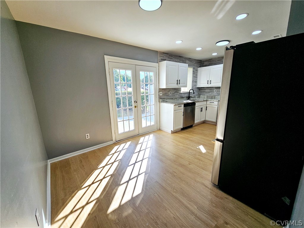 3501 Luckylee Crescent Richmond, VA 23234 - Photo 4 of 16 a view of a kitchen with refrigerator and a stove top oven