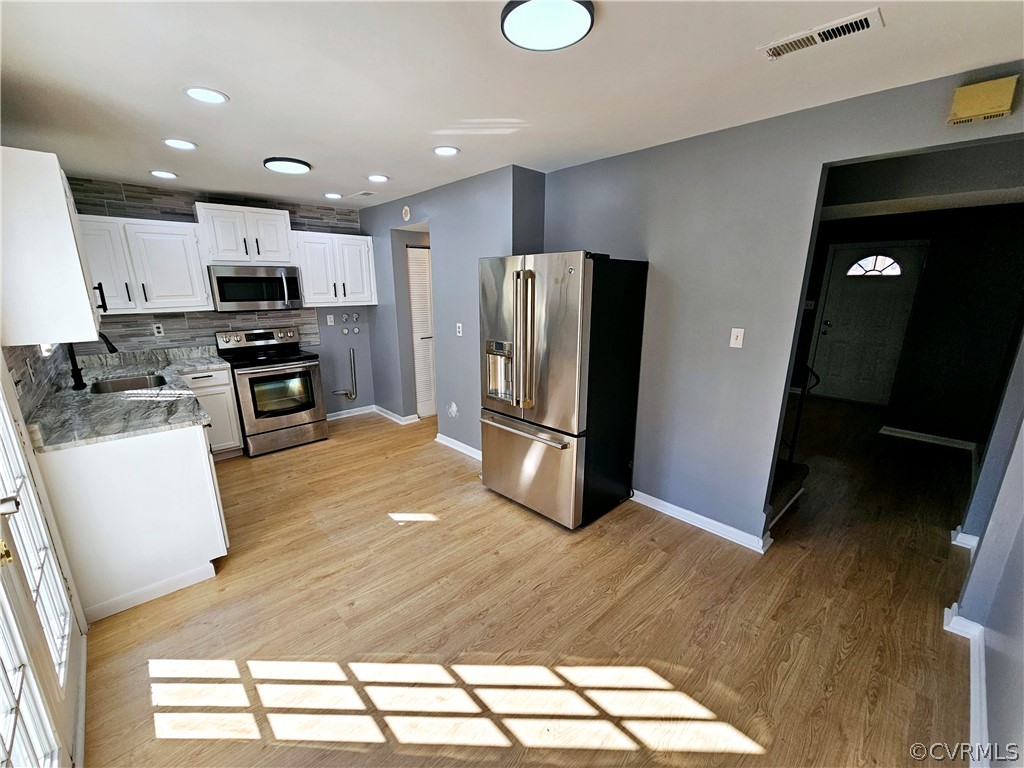 3501 Luckylee Crescent Richmond, VA 23234 - Photo 5 of 16 a kitchen with stainless steel appliances granite countertop a refrigerator and a stove