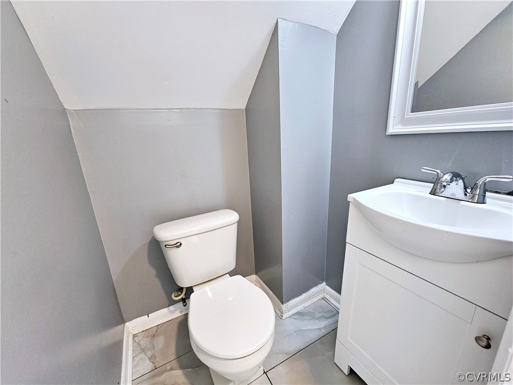 3501 Luckylee Crescent Richmond, VA 23234 - Photo 9 of 16 a white toilet sitting next to a bathroom sink