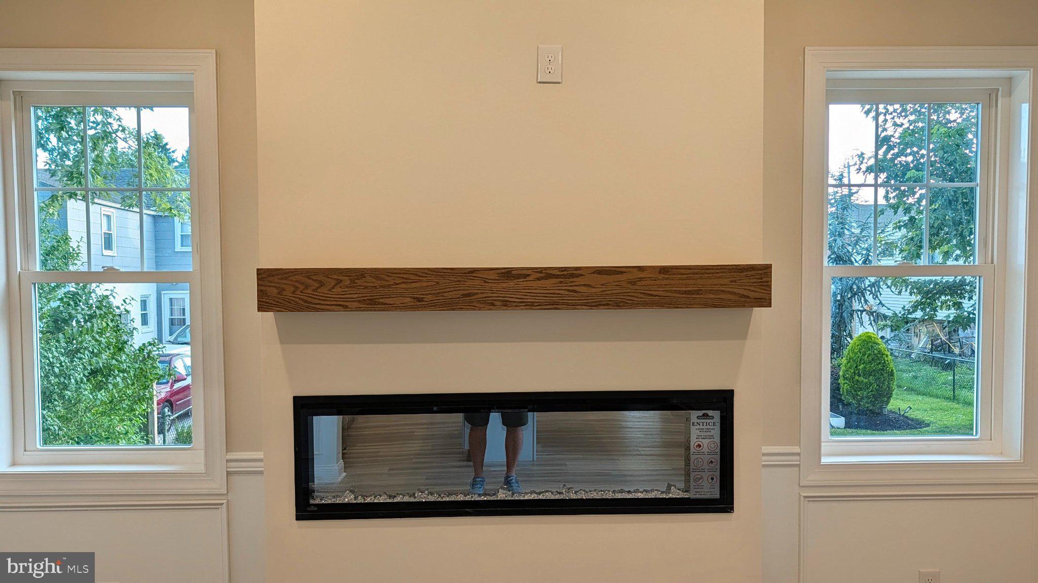 425 Rutledge Avenue Folsom, PA 19033 - Photo 16 of 33 Modern fireplace flanked by windows.