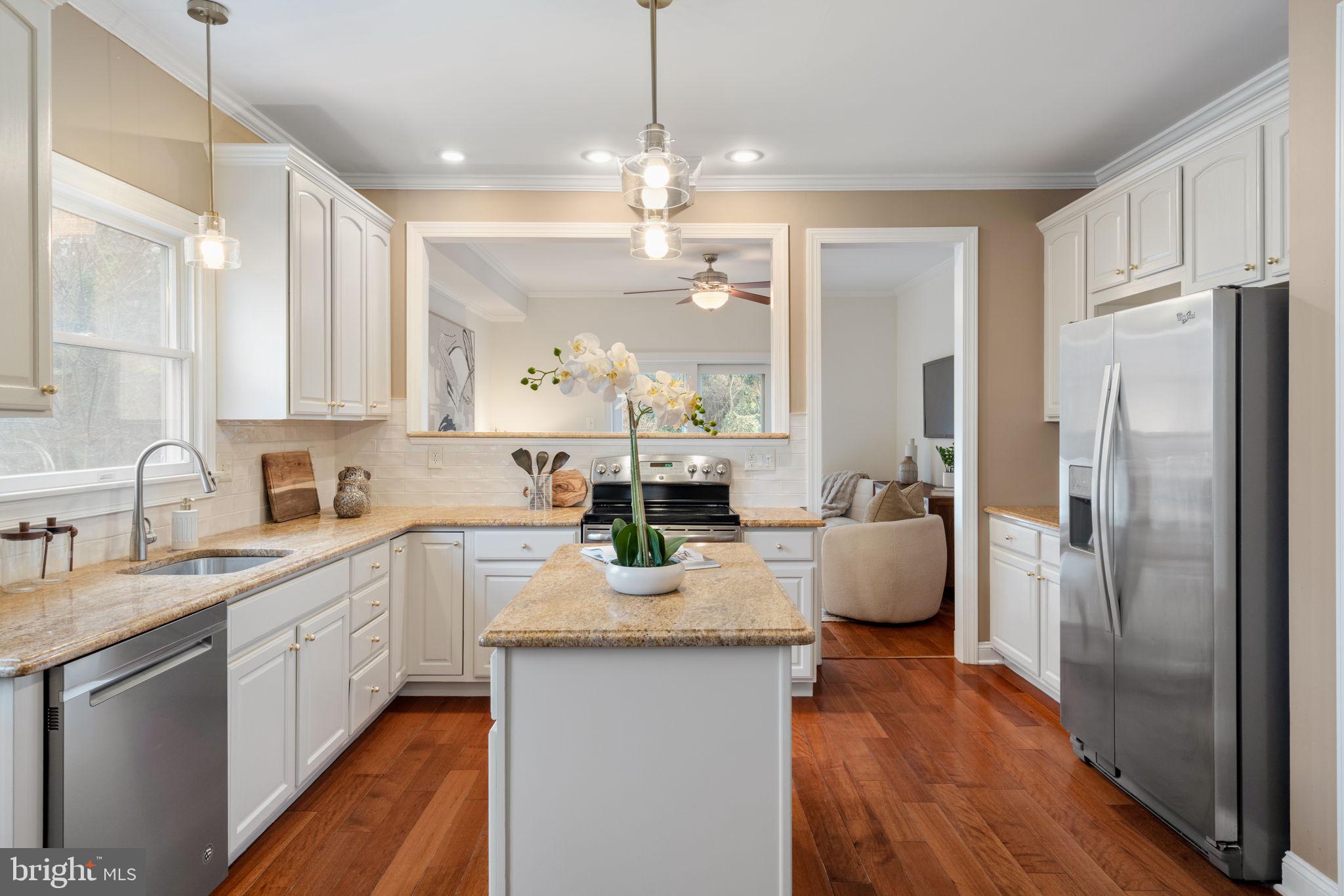 1723 Powder Mill Lane Wynnewood, PA 19096 - Photo 16 of 46 a kitchen with sink refrigerator and cabinets