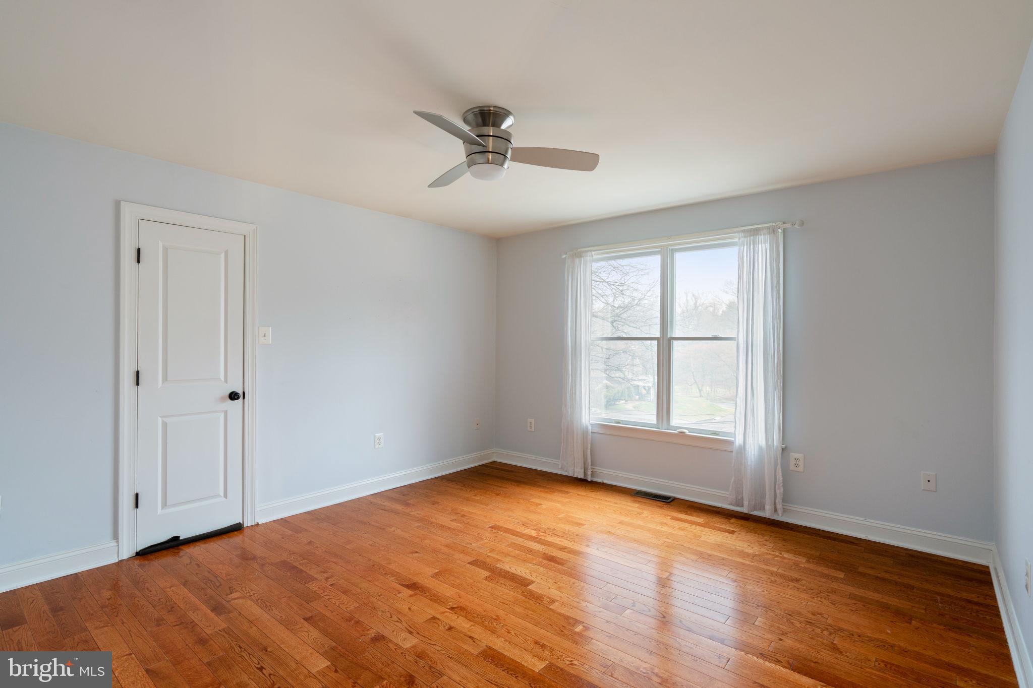 1723 Powder Mill Lane Wynnewood, PA 19096 - Photo 36 of 46 a view of empty room with wooden floor and fan