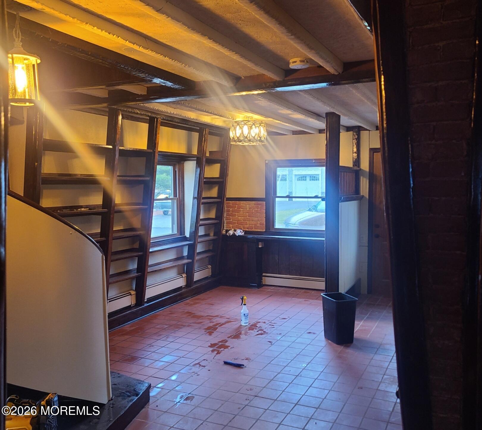 634 Point Avenue Brick, NJ 08724 - Photo 3 of 15 a view of an empty room with wooden floor and a window