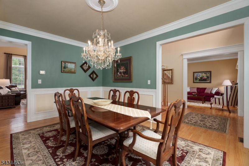 110 Orchard Road Skillman, NJ 08558 - Photo 7 of 43 a view of a dining room with furniture and chandelier