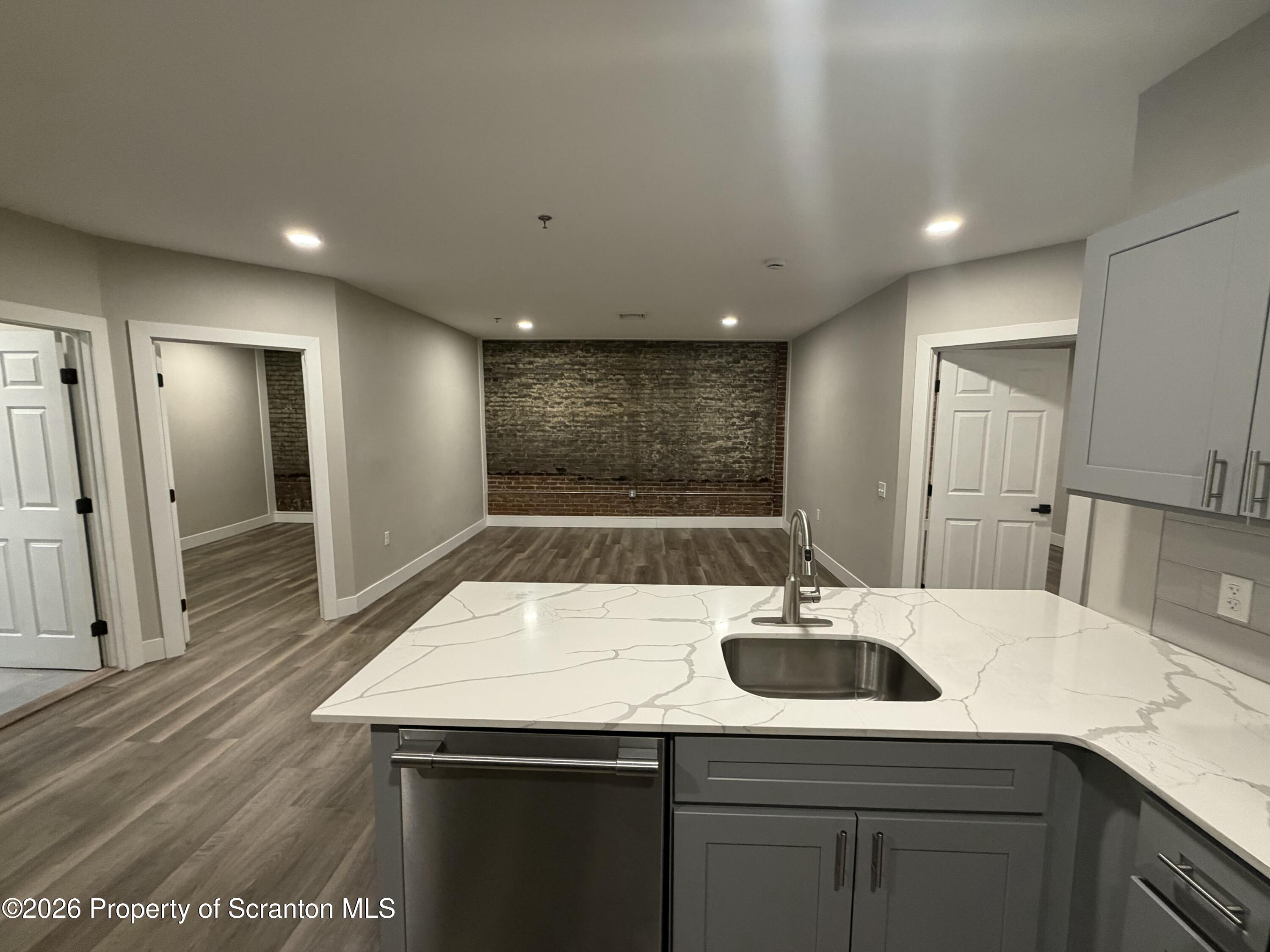 a kitchen with a sink and a refrigerator