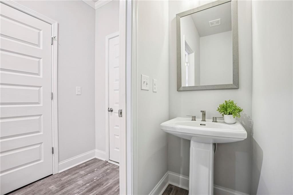5064 Insperon Lane, Unit 34 Peachtree Corners, GA 30092 - Photo 15 of 48 a bathroom with a sink and a mirror