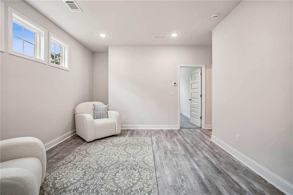 5064 Insperon Lane, Unit 34 Peachtree Corners, GA 30092 - Photo 16 of 48 a view of livingroom with furniture and window