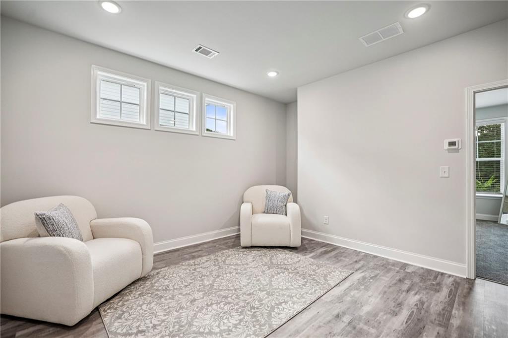 5064 Insperon Lane, Unit 34 Peachtree Corners, GA 30092 - Photo 18 of 48 a living room with furniture