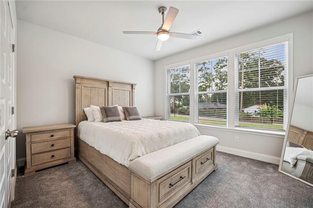 5064 Insperon Lane, Unit 34 Peachtree Corners, GA 30092 - Photo 24 of 48 a bed room with a bed and a tv