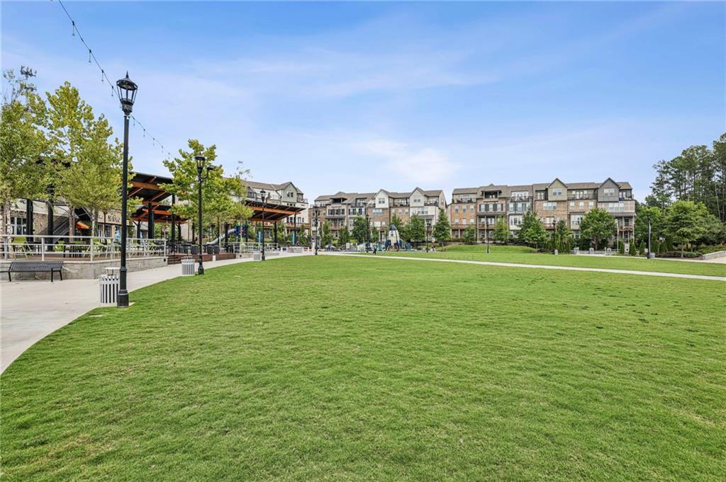 5064 Insperon Lane, Unit 34 Peachtree Corners, GA 30092 - Photo 41 of 48 a view of a green field