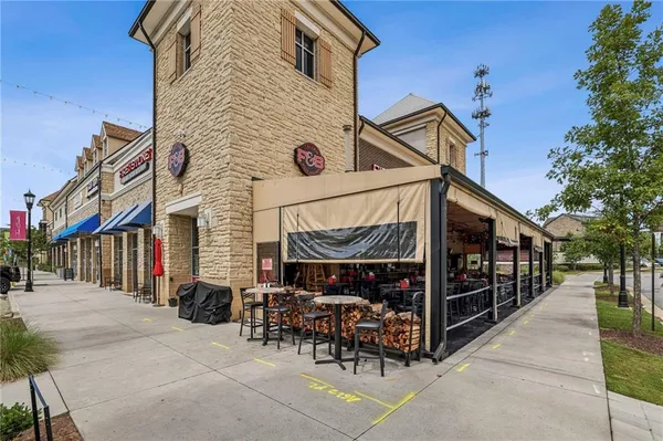 a view of a building with sitting area