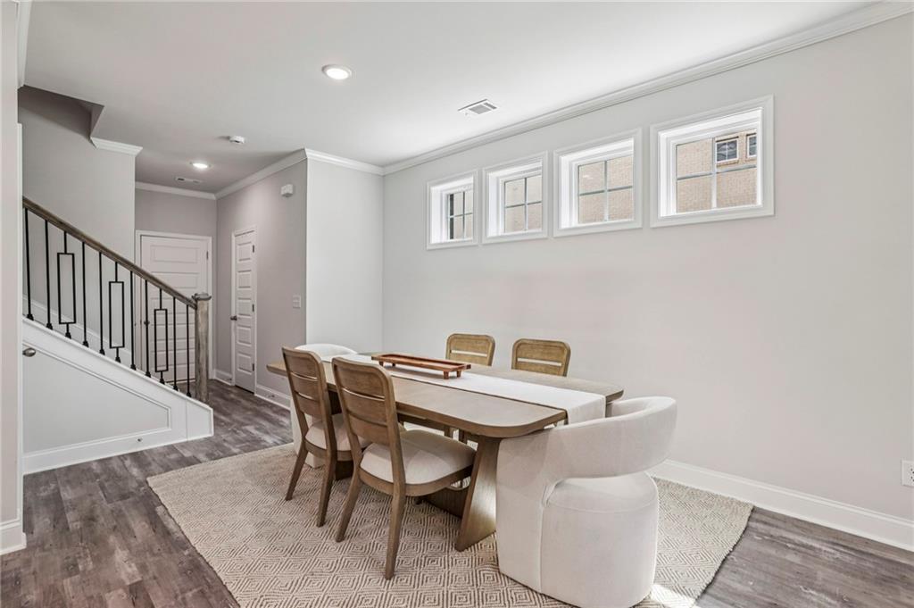 5064 Insperon Lane, Unit 34 Peachtree Corners, GA 30092 - Photo 6 of 48 a view of a dining room with furniture