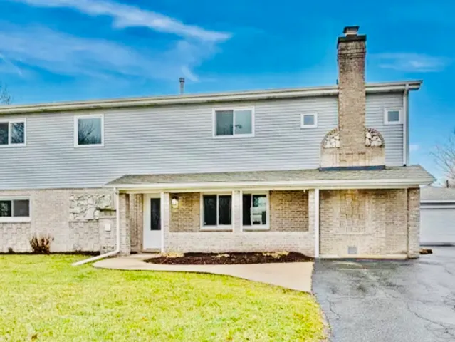 a front view of a house with swimming pool