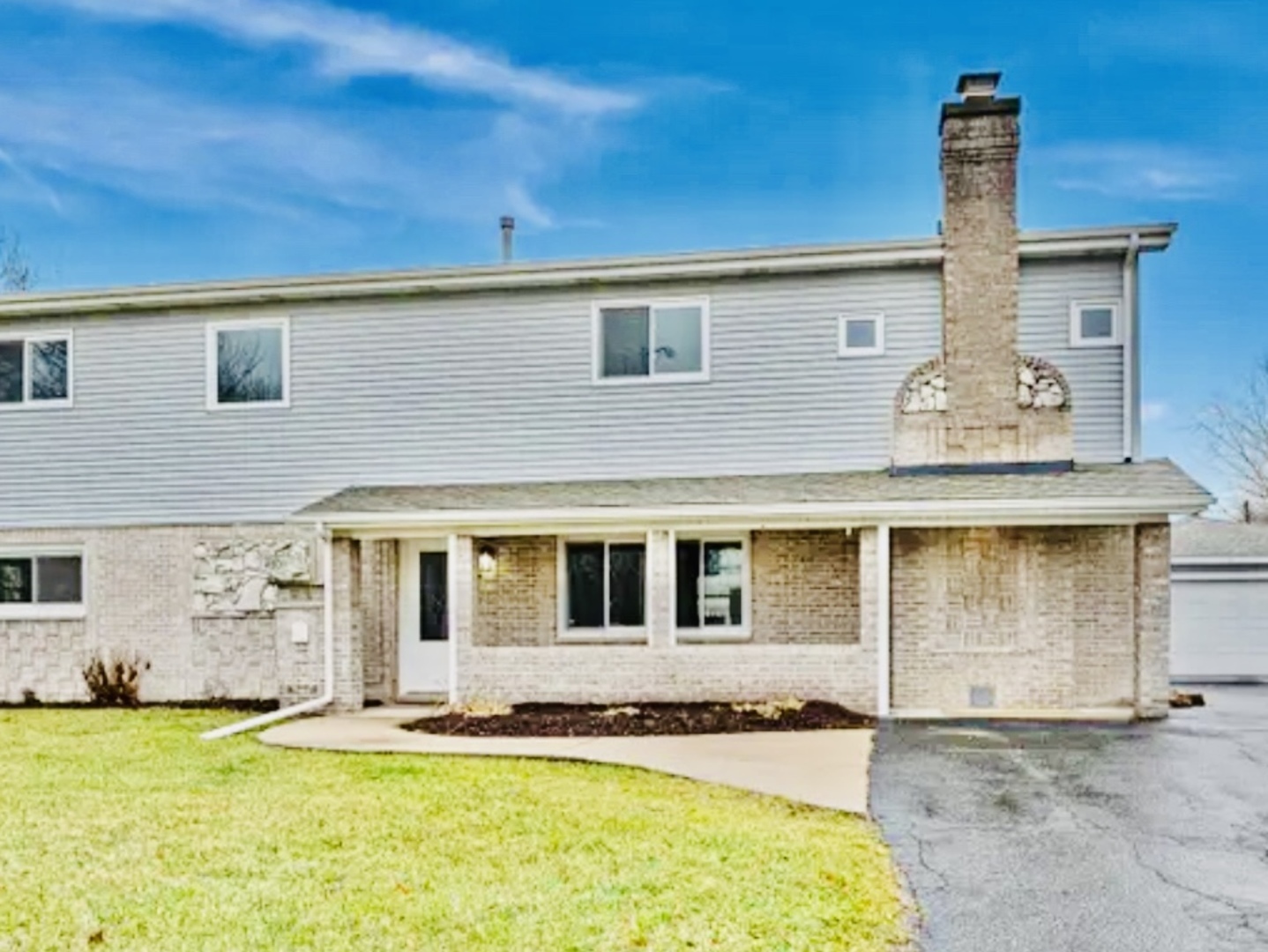 4501 185th Street Country Club Hills, IL 60478 - Photo 2 of 27 a front view of a house with a yard
