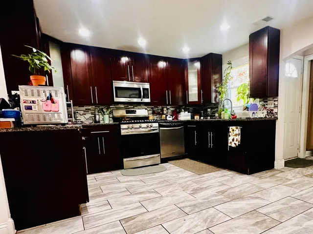 a view of a dining room with furniture and window