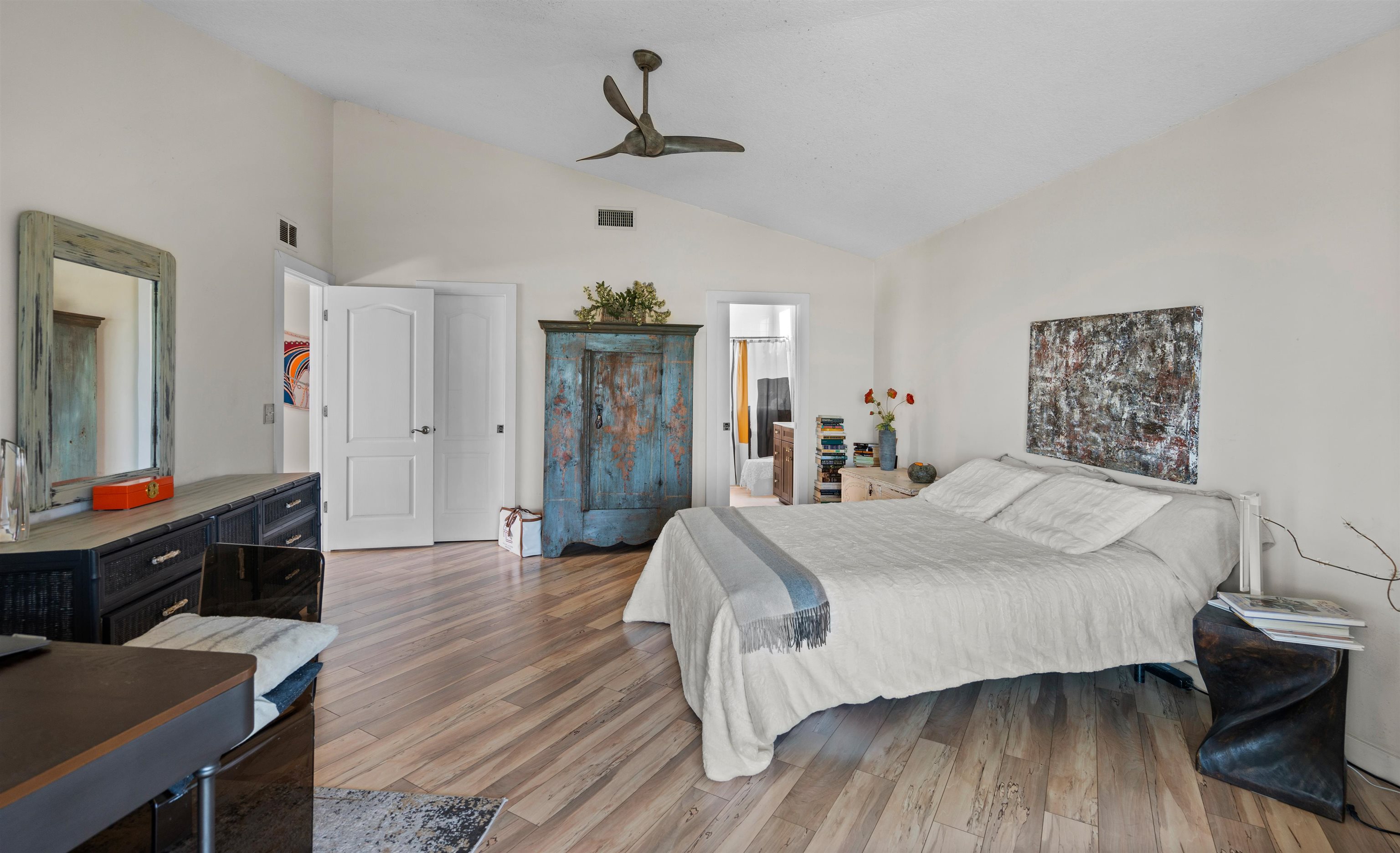 9244 July Lane St. Augustine, FL 32080 - Photo 19 of 66 a bedroom with a bed and wooden floor